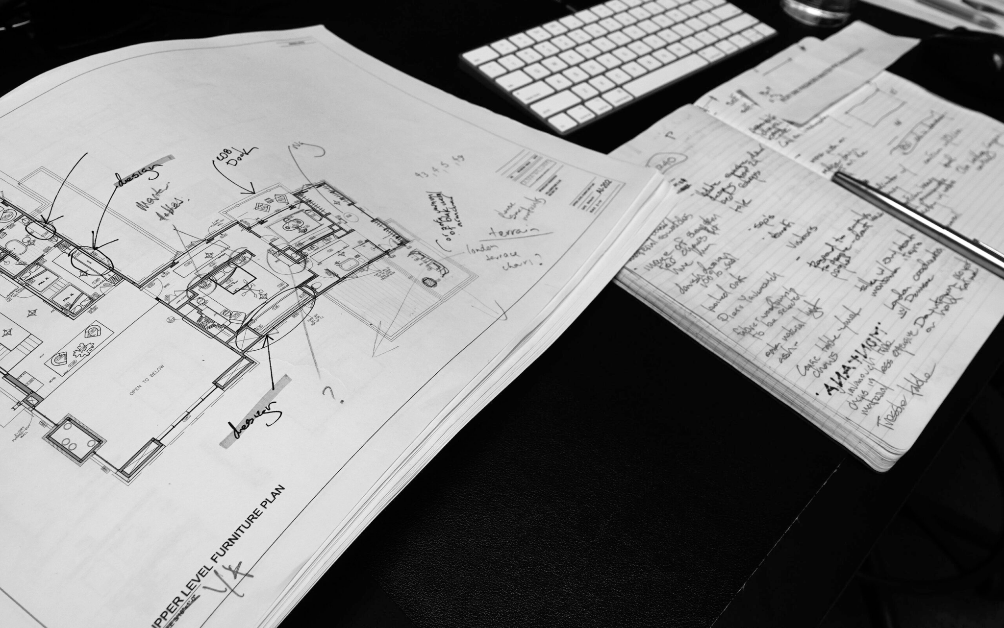Close up image of notes and furniture plans from the studio.